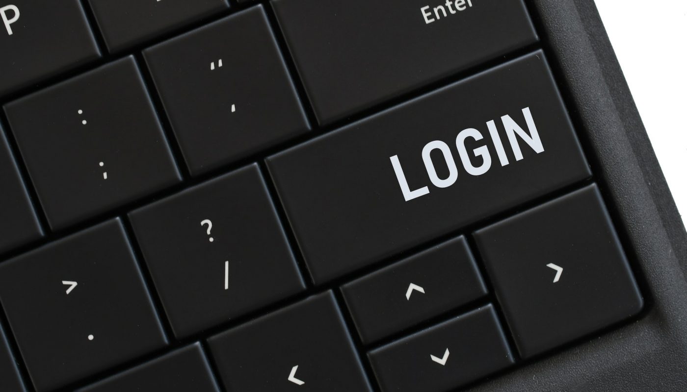 Login button on a computer keyboard for accessing your account online on a website